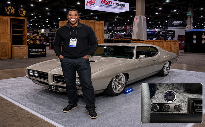Michael Strahan with a 1969 Pontiac GTO equipped with a Digital Guard Dawg push-to-start system